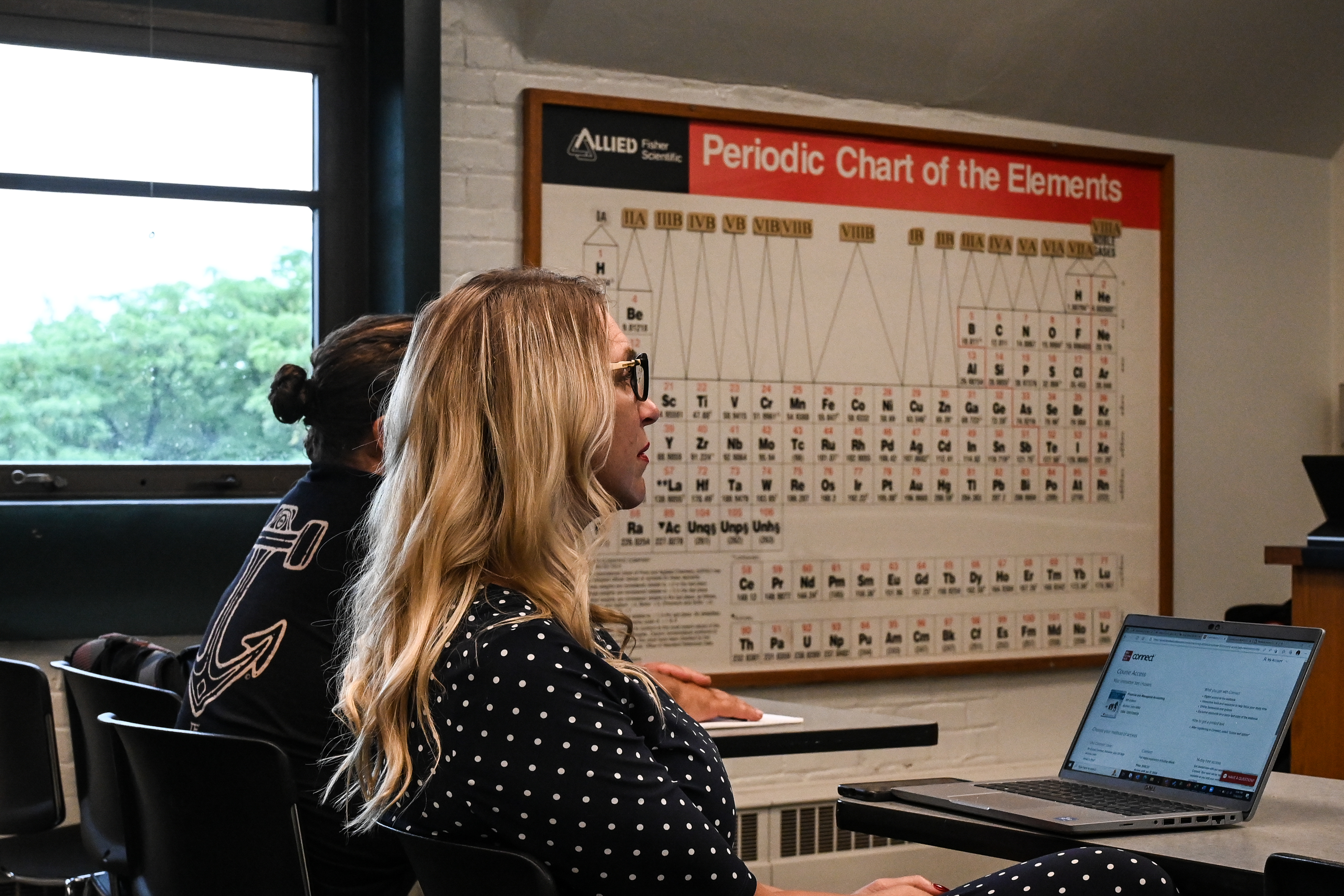 woman and periodic chart